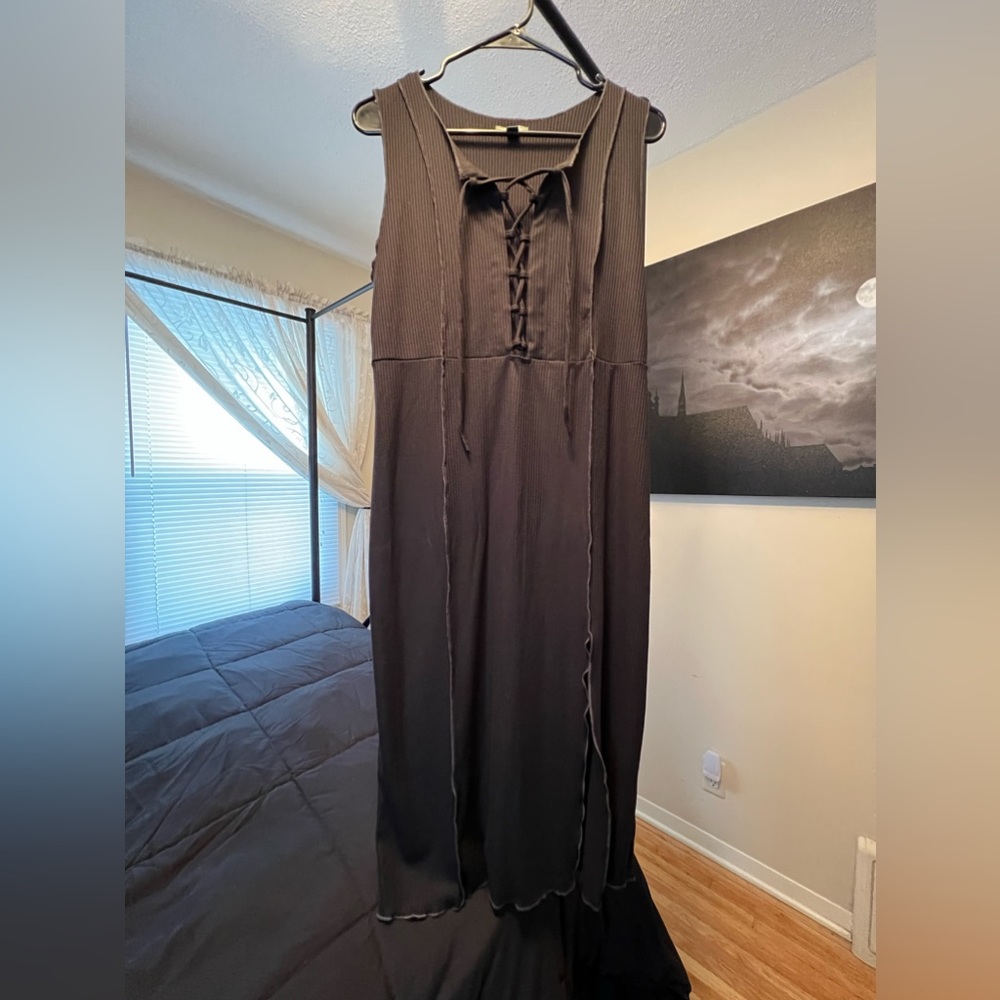 Long short sleeve dress with lace up front and left slit.